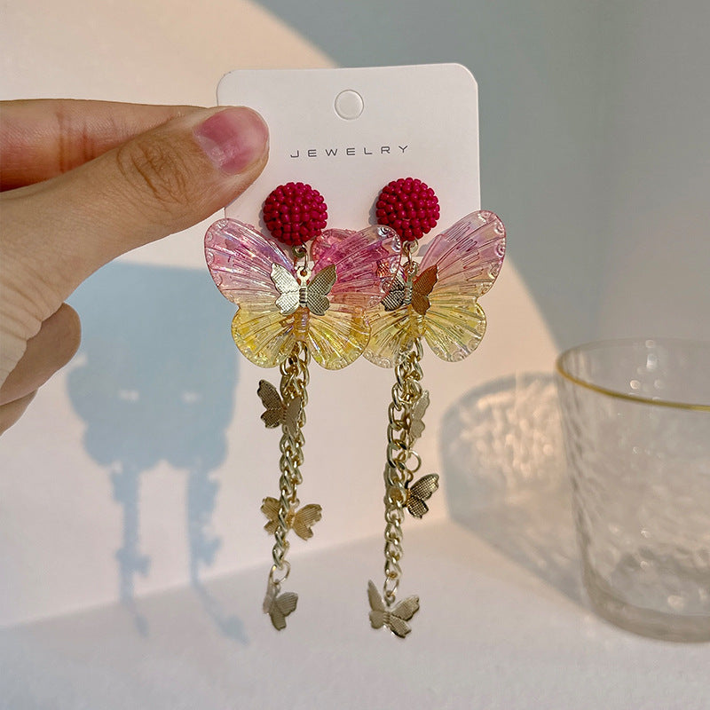 Pendientes de aleación de mariposa acrílica larga de borla larga al por mayor